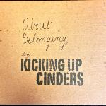 Kicking Up Cinders - About Belonging